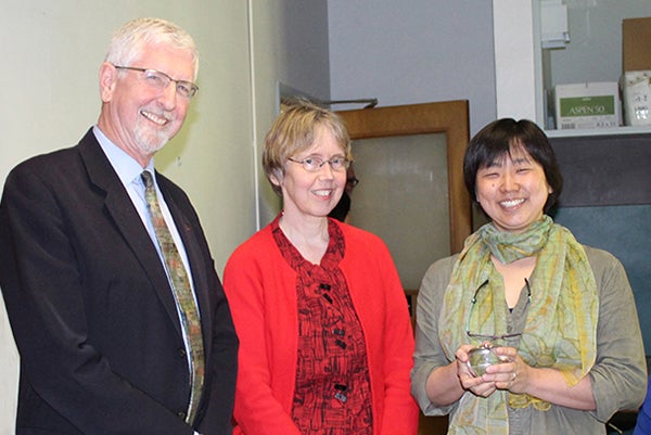 Associate Professor Akiko Walley (right) celebrates her Herman award with Provost Scott Coltrane and Senior Vice Provost Susan Anderson