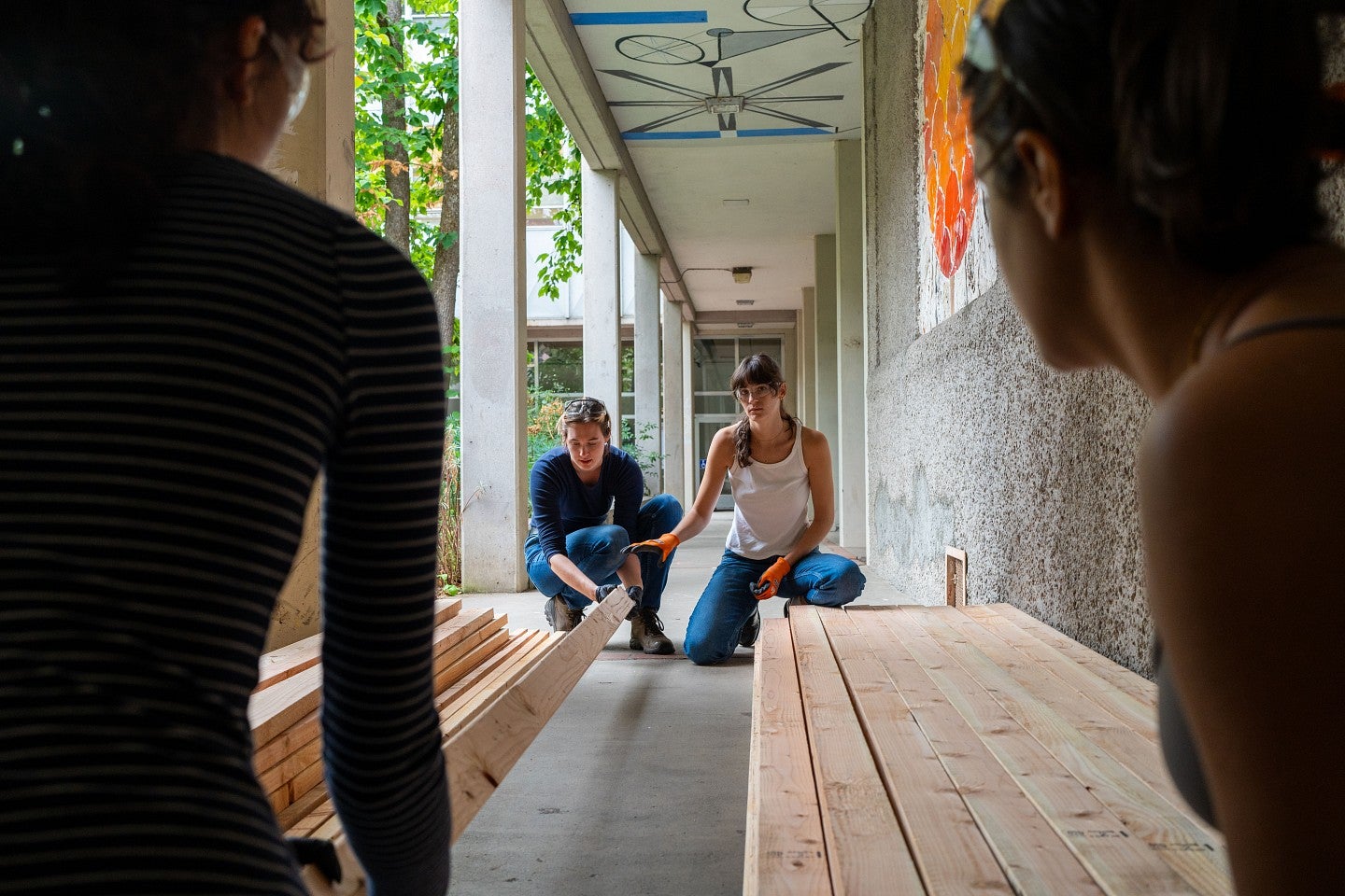 24 Bruton Design Intensive shot of students working with work.