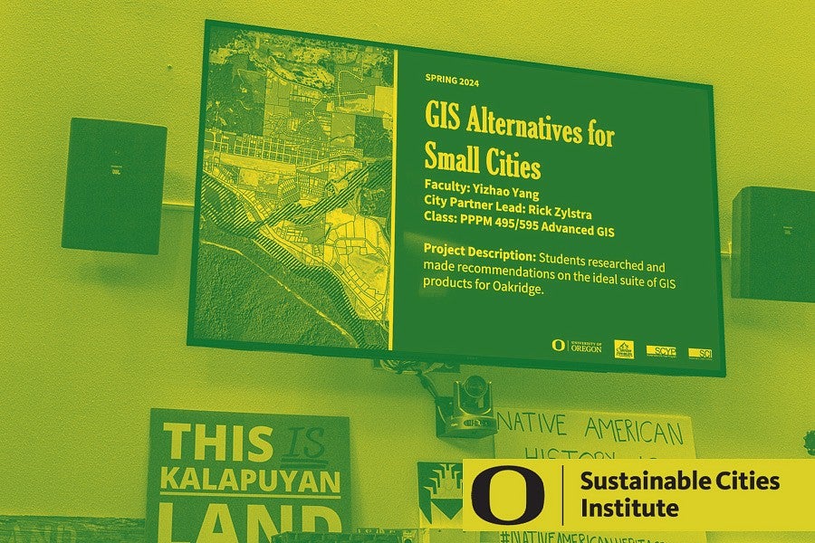 A monitor displaying the GIS Alternatives for Small Cities class slide for the SCYP kick-off. 