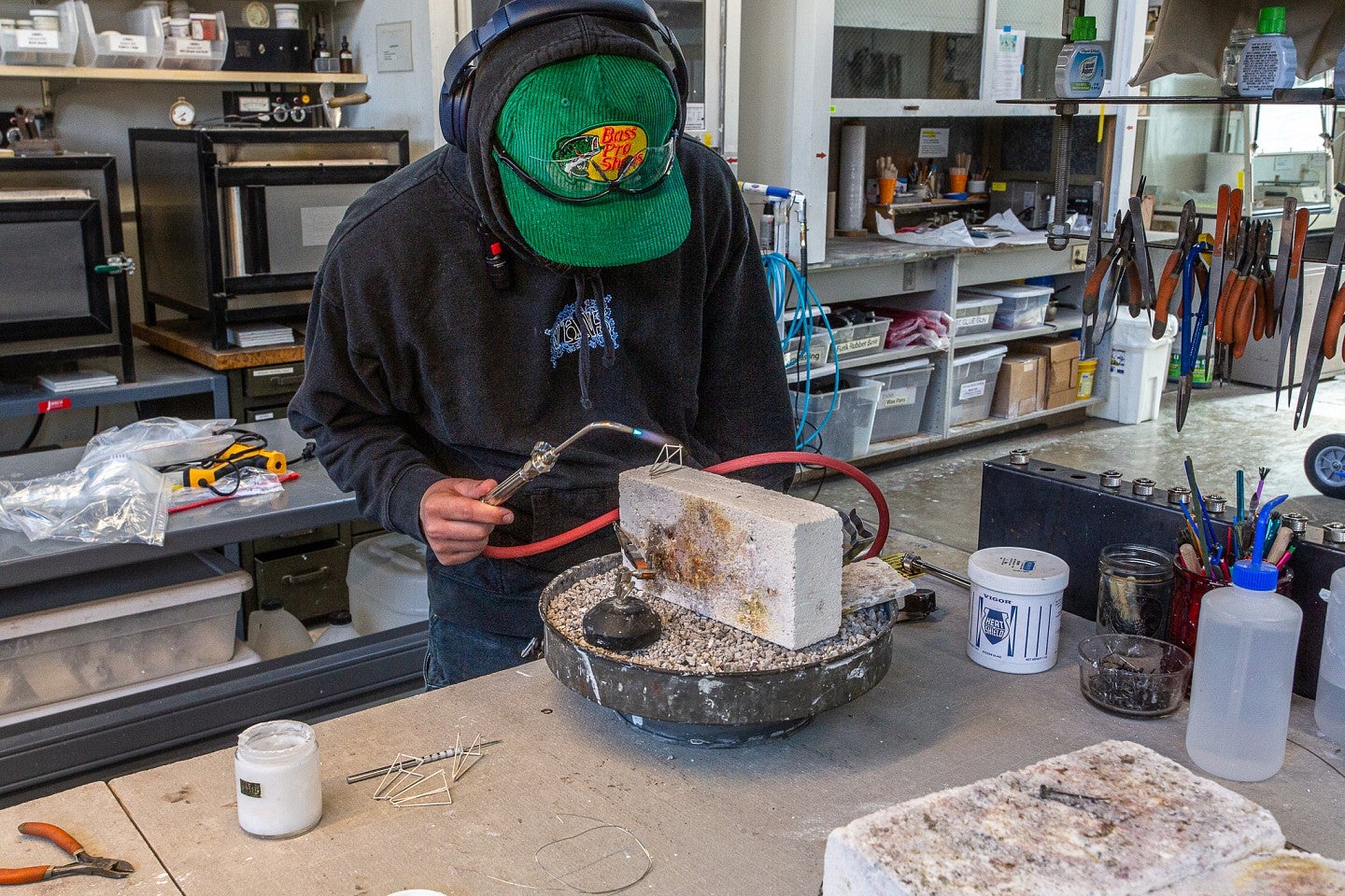 Photograph of Ignatius working in the jewelry studio