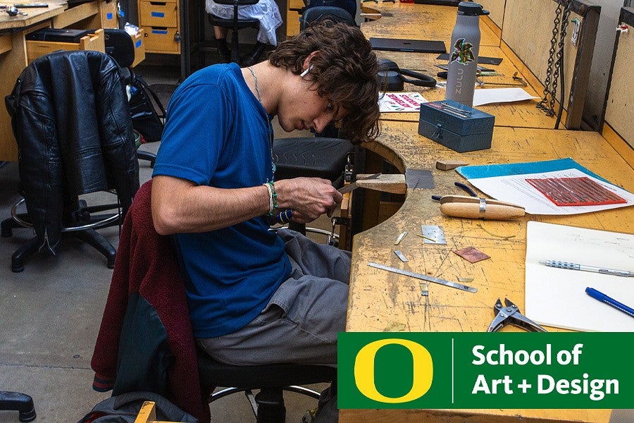 Photograph of a student working on jewelry. 