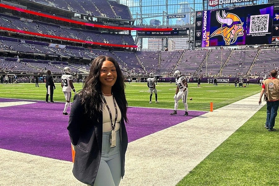 Naomi photograph on the Minnesota Vikings football team field. 