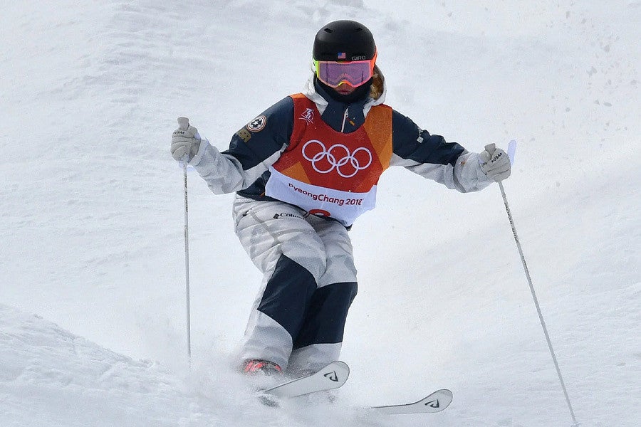 Photograph of a skier going down a slope at the Winter Games. 