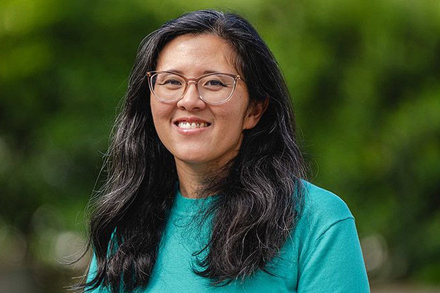 Nicole Ngo news header for story. Shows a portrait of a woman in front of a blurry green background. Decorative. 