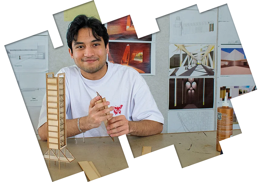 Decorative image of a student posing with architecture work. 