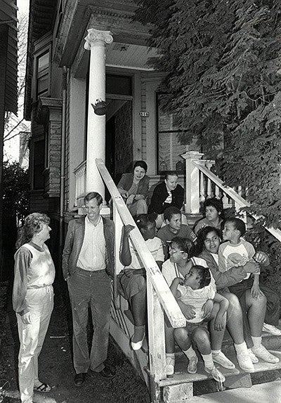 Rick Michaelson with manager Patty Cook and other residents of the emergency shelter