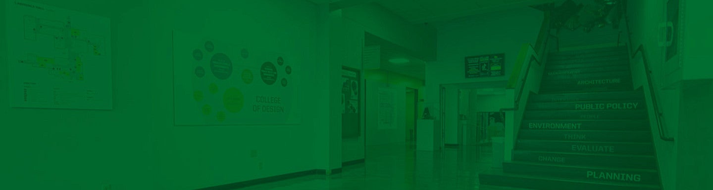 Photograph of the Lawrence Hall lobby from the south entrance looking north. Has a UO green overlay.