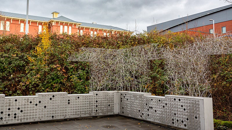 metallic structure holding urns