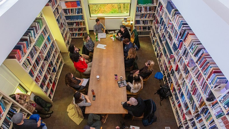 Photograph of students in an art presentation. 