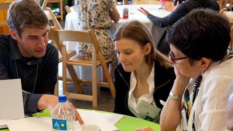 people talk at tables