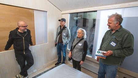 Photograph of Judith Sheine at an Open House. 