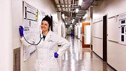 woman in hallway with stethoscope