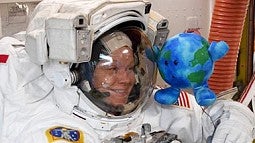 astronaut with earth toy