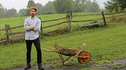 man with a wooden wheelbarrow 