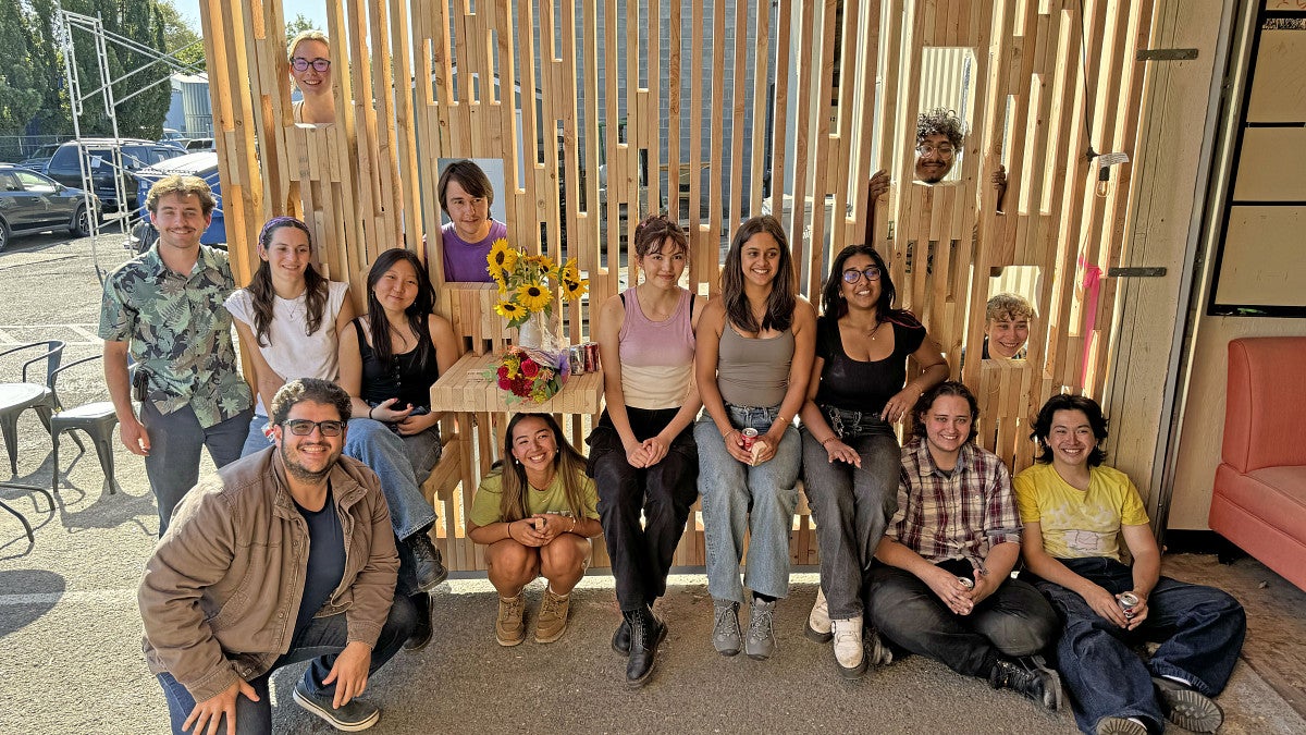 BDI students posing in the finished shelter.