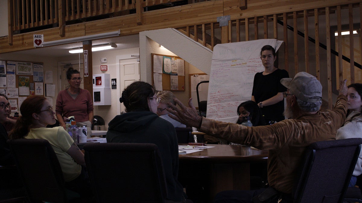 Students meet with Everyone Village residents to talk about the BDI. 