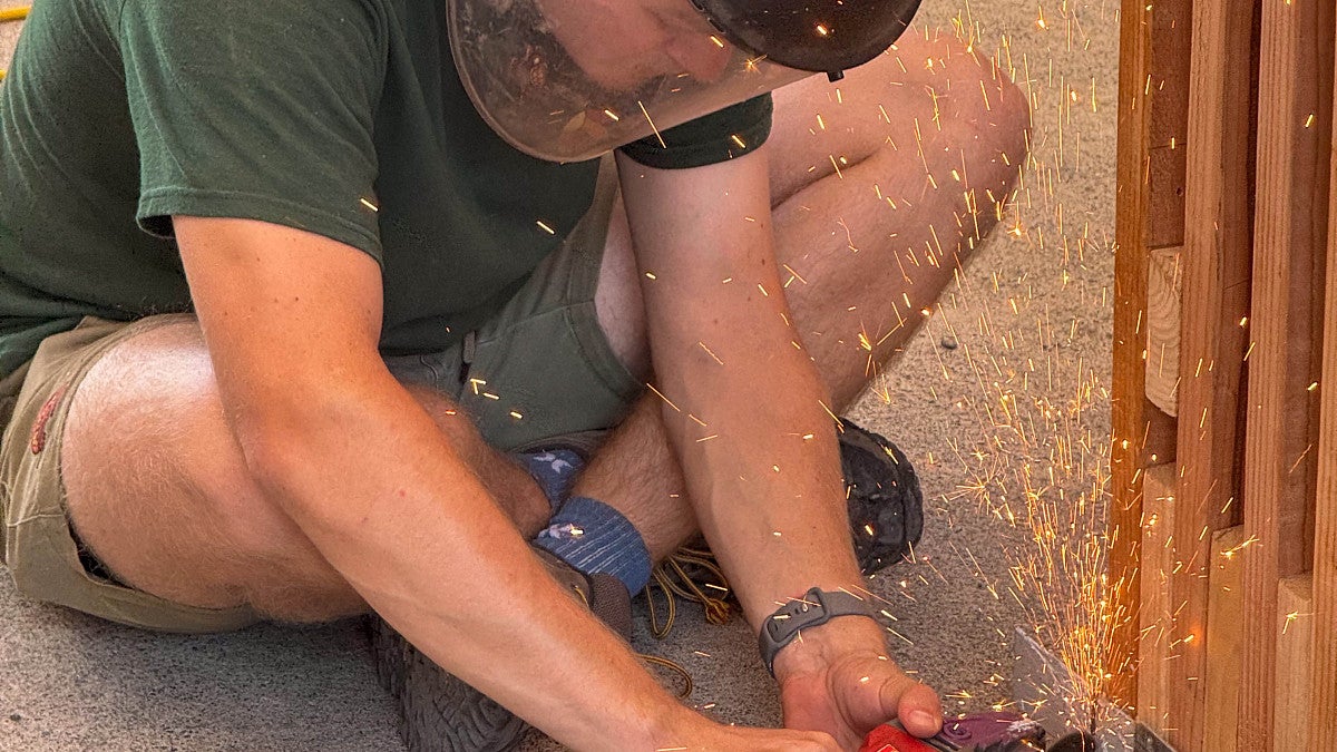 Student uses a grinder in the BDI project. 