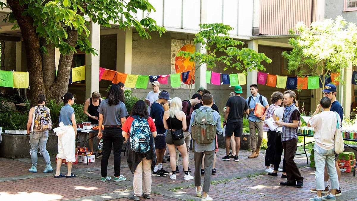 people gather in the Lawrence Hall courtyard for Spring Storm activities