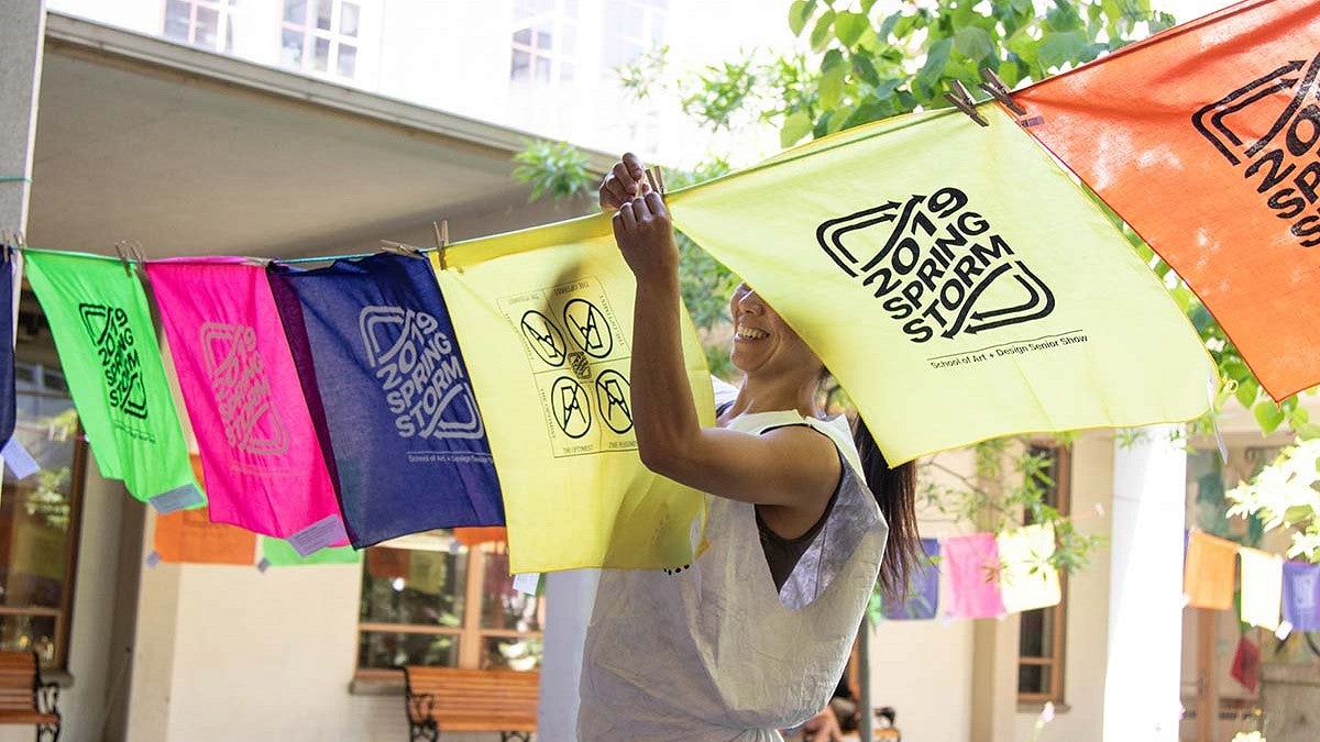 printmaker hangs printed bandanas