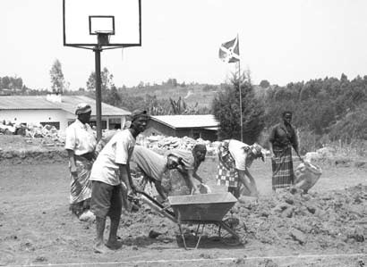 People working in front of a basketball hoop