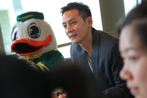 Daniel Wu meets with students, while the Duck observes, in the Ford Alumni Center.