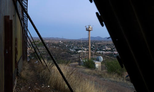 View into Nogales from the Border Fence (with camera tower), Arizona.