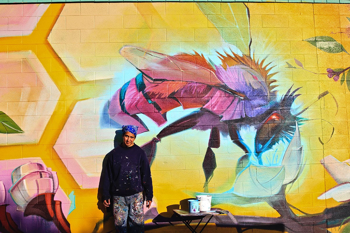 Artist Steve Lopez with Mural