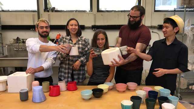From left, Thomas Sprott, Aileen Tran, Julia Sherman, Brian Gillis, and Yang Li pose with their ceramic cups. Photo courtesy Aileen Tran.