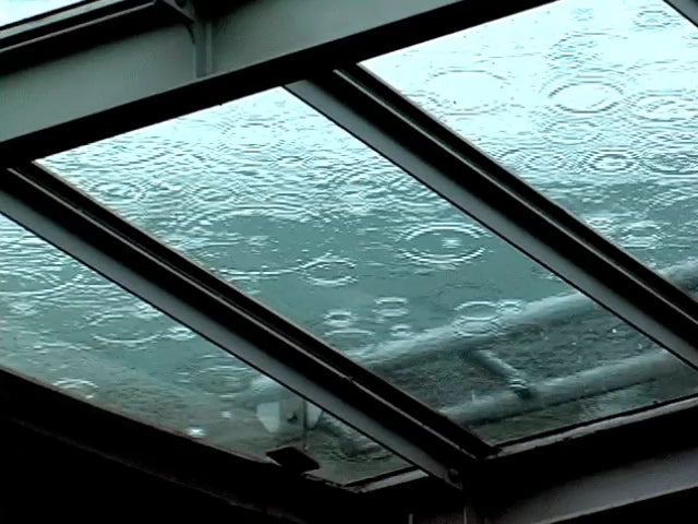 raindrops fall on glass ceiling