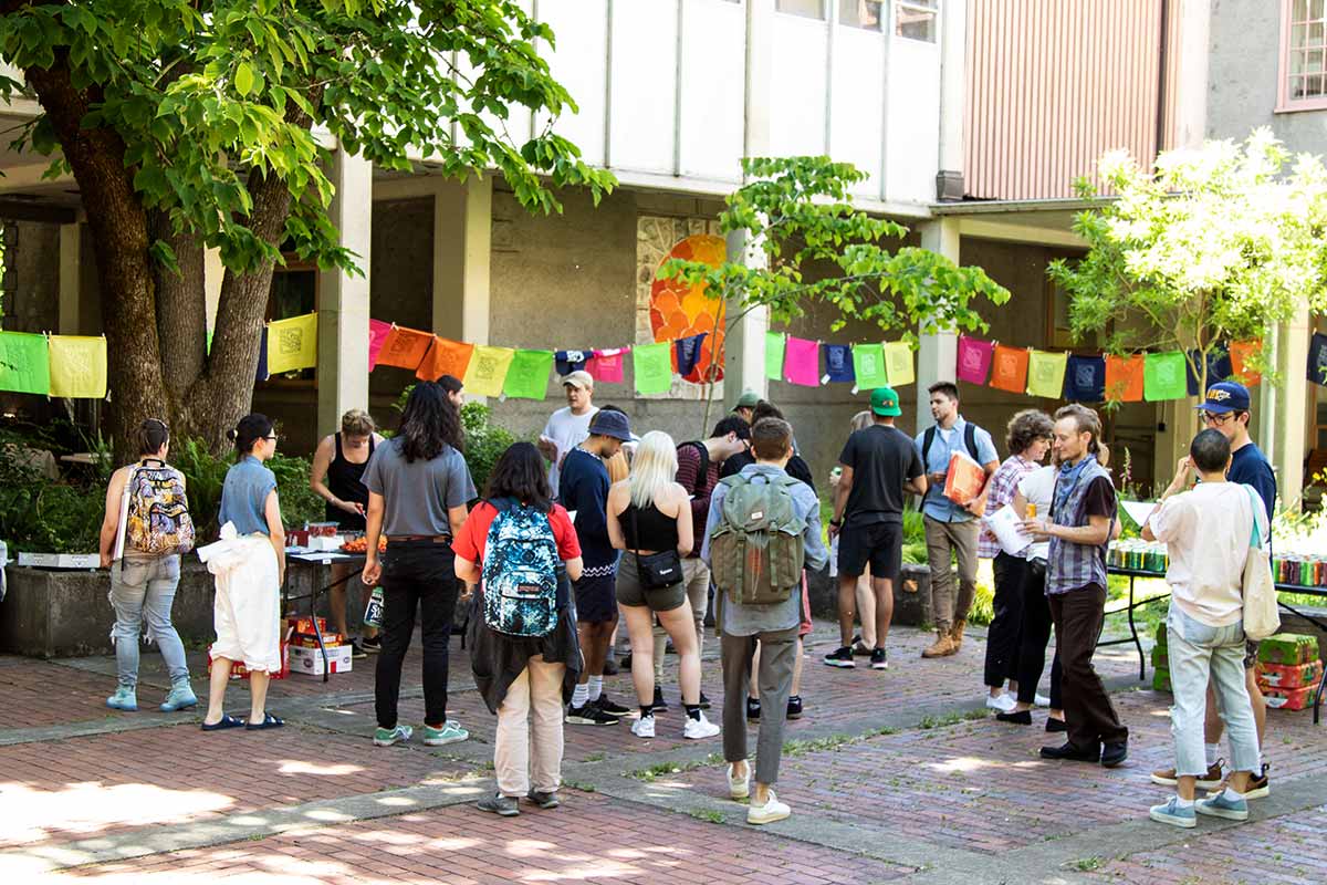 people gather in the Lawrence Hall courtyard for Spring Storm activities