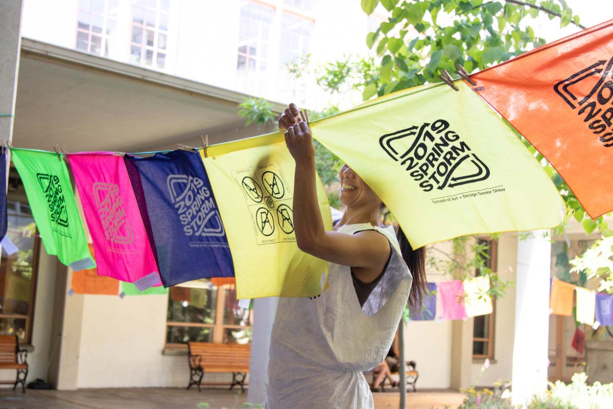 printmaker hangs printed bandanas