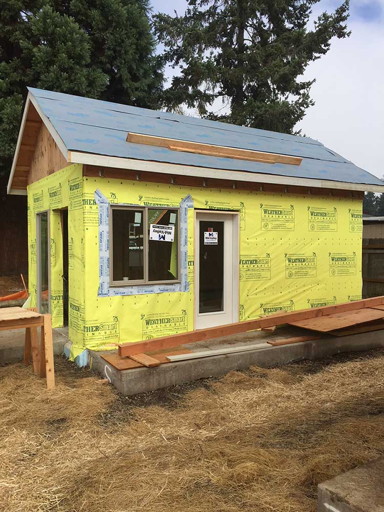 Fifield’s house with windows installed moves nearer to completion on its Emerald Village site.