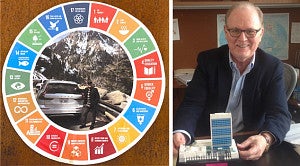  Cain shows his pride in his work at the UN through his personalized license plate and the model he is holding of the UN headquarters building, made by his grandson using legos. 