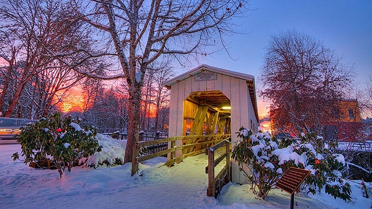 covered bridge in the snow at sunset, photo by Ryan Kimball