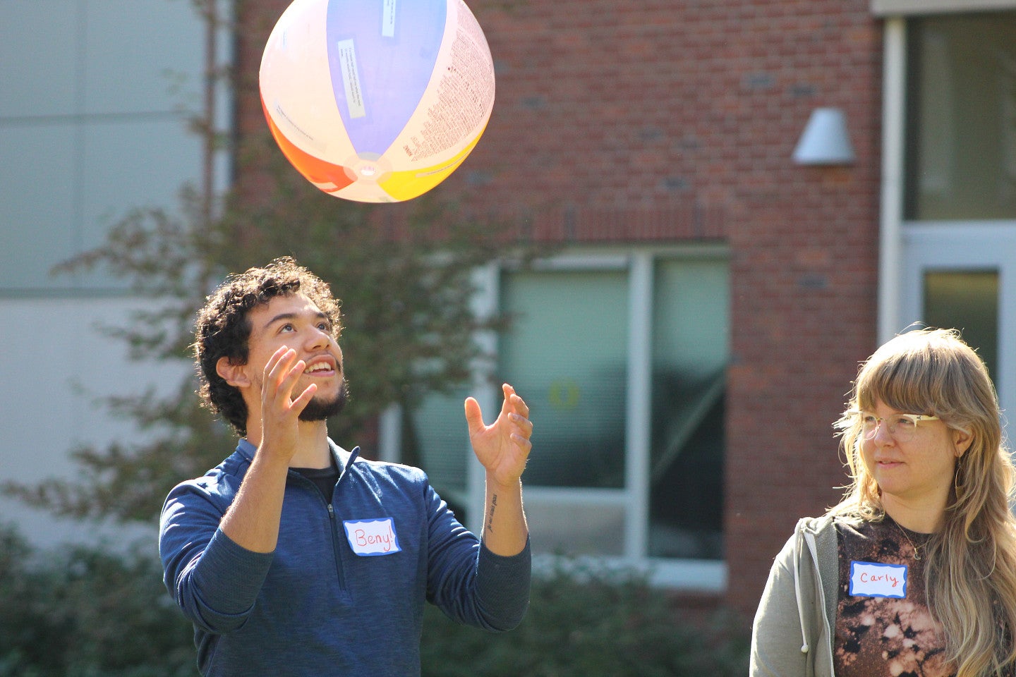 Photograph of RARE cohort member, Beny, participating in a team building exercise with a beach ball.