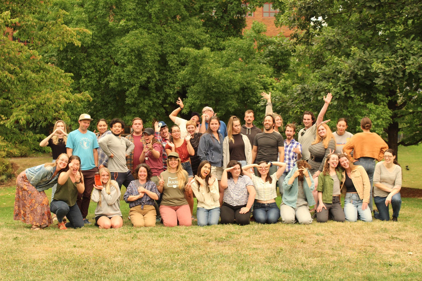 Photo of the full RARE cohort and staff lined into two rows, making silly faces outside. 