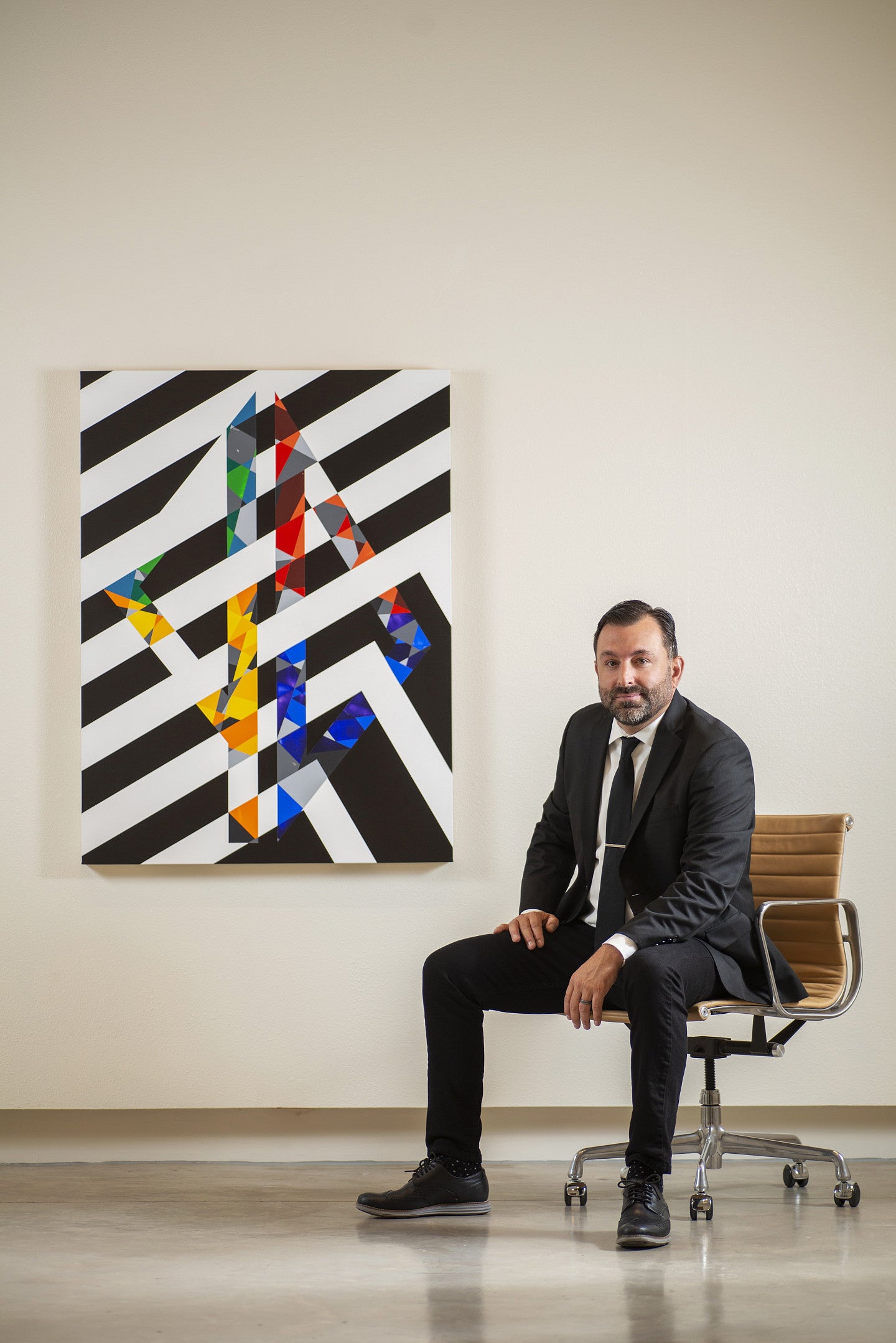 Image of Scott Malbaurn next to his painting