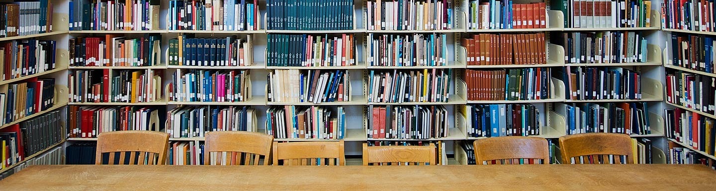 books, chairs and table in library