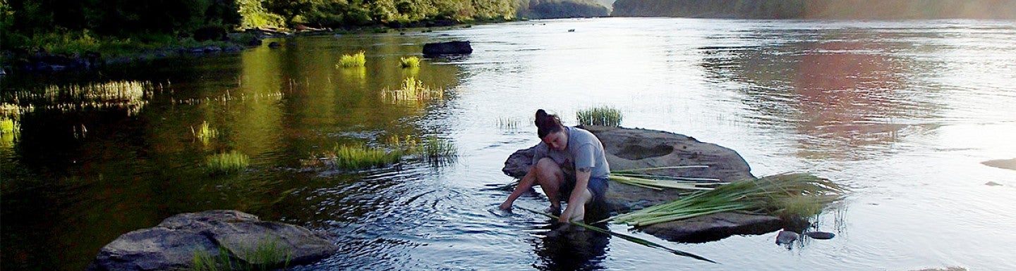 Landscape Architecture student Amanda Craig in a river
