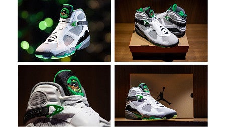 Different angles of the Jordan shoe. It is mostly what with black and green accents on the sole and tongue. The tonghue 