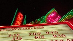 photo of a cinema marquee in neon