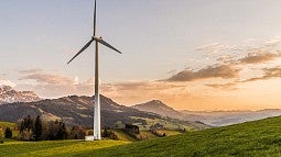 Photo of a wind turbine in mountains