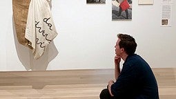 Graduate student Liam Maher looking at art at the MoMA in New York