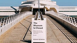 photo of the exterior of a museum with a closed sign