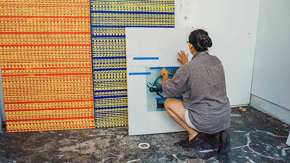 Kathryn Liu prepares artwork for display in 2019 Spring Storm exhibit