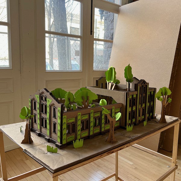3D Cardboard Model of a "Living Building," a building co-existing with trees and plants built into the design.