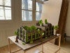 3D Cardboard Model of a "Living Building," a building co-existing with trees and plants built into the design.