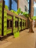 3D Cardboard Model of a "Living Building," a building co-existing with trees and plants built into the design.